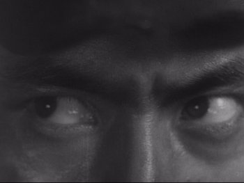 Movie still from “Stray Dog” (1949), directed by Akira Kurosawa – View of a man's eyes in black and white; Extreme Close Up shot, High angle