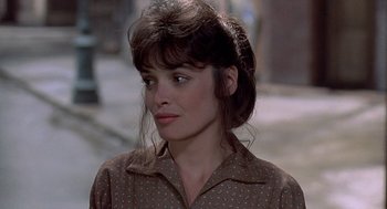 Movie still from “Streets of Fire” (1984), directed by Walter Hill – A person wearing a brown shirt; Close Up shot, Over the shoulder angle