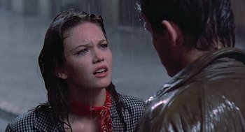 Movie still from “Streets of Fire” (1984), directed by Walter Hill – A woman with a bandanna on her head and a man with a bandanna on his head; Close Up shot, Over the shoulder angle