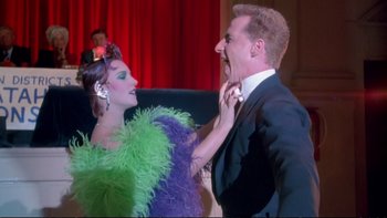 Movie still from “Strictly Ballroom” (1992), directed by Baz Luhrmann – A man and a woman are dancing together; Medium shot, Low angle