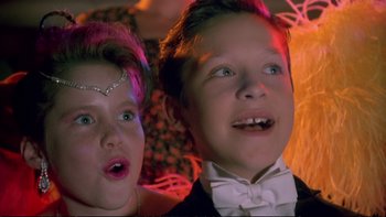 Movie still from “Strictly Ballroom” (1992), directed by Baz Luhrmann – Two young people are looking up at the ceiling; Close Up shot, Low angle