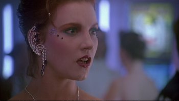Movie still from “Strictly Ballroom” (1992), directed by Baz Luhrmann – A person with makeup on their face; Close Up shot, Low angle