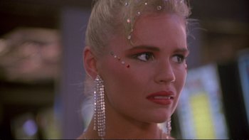 Movie still from “Strictly Ballroom” (1992), directed by Baz Luhrmann – A person wearing a dress; Close Up shot, Over the shoulder angle