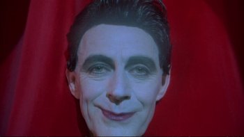 Movie still from “Strictly Ballroom” (1992), directed by Baz Luhrmann – The face of a man with blue eyes; Close Up shot, High angle