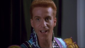 Movie still from “Strictly Ballroom” (1992), directed by Baz Luhrmann – A person wearing a costume; Close Up shot, Low angle