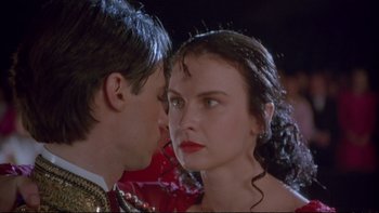 Movie still from “Strictly Ballroom” (1992), directed by Baz Luhrmann – A man and a woman are looking into each others eyes; Close Up shot, Over the shoulder angle