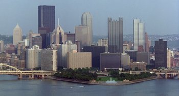 Movie still from “Striking Distance” (1993), directed by Rowdy Herrington – A view of a city from across the river; Extreme Wide shot, High angle