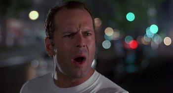 Movie still from “Striking Distance” (1993), directed by Rowdy Herrington – A person with his mouth wide open; Close Up shot, Low angle