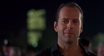 Movie still from “Striking Distance” (1993), directed by Rowdy Herrington – A person wearing a black shirt; Close Up shot, Low angle