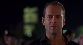 Movie still from “Striking Distance” (1993), directed by Rowdy Herrington – A person wearing a black shirt; Close Up shot, Low angle