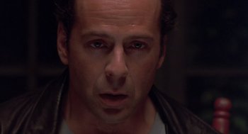 Movie still from “Striking Distance” (1993), directed by Rowdy Herrington – A person wearing a leather jacket; Close Up shot, Low angle