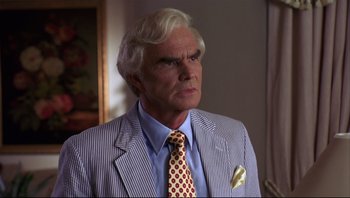 Movie still from “Striptease” (1996), directed by Andrew Bergman – An older man wearing a striped jacket and a tie; Close Up shot, Low angle