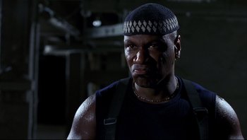 Movie still from “Striptease” (1996), directed by Andrew Bergman – A person wearing a hat; Close Up shot, Low angle