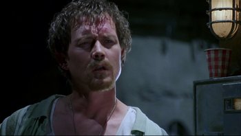 Movie still from “Striptease” (1996), directed by Andrew Bergman – A person wearing a shirt; Close Up shot, Low angle