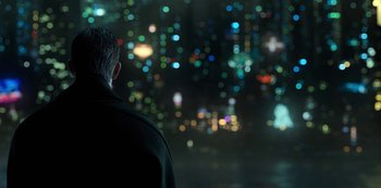 Movie still from “Altered Carbon” (2018), created by Laeta Kalogridis – A man standing in front of a city at night; Medium shot, Over the shoulder angle