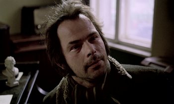Movie still from “Stroszek” (1977), directed by Werner Herzog – A person with a beard; Close Up shot, Low angle