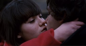 Movie still from “Submarine” (2010), directed by Richard Ayoade – A young woman and a young man are kissing; Close Up shot, Overhead angle