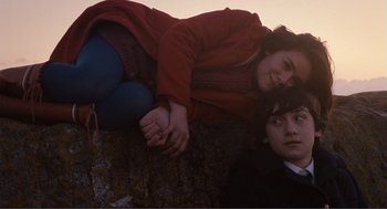 Movie still from “Submarine” (2010), directed by Richard Ayoade – A man and a woman laying on the ground; Medium shot, High angle