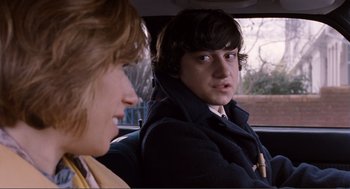 Movie still from “Submarine” (2010), directed by Richard Ayoade – A man and a woman sitting in the back seat of a car; Close Up shot, Over the shoulder angle