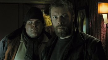 Movie still from “Submarino” (2010), directed by Thomas Vinterberg – A man with a goatee and a man with a beard; Close Up shot, Low angle