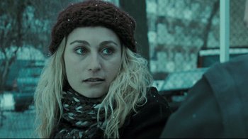 Movie still from “Submarino” (2010), directed by Thomas Vinterberg – A person wearing a hat and a scarf; Close Up shot, Over the shoulder angle