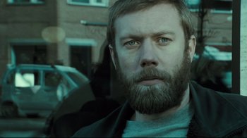 Movie still from “Submarino” (2010), directed by Thomas Vinterberg – A person with a beard; Close Up shot, Over the shoulder angle