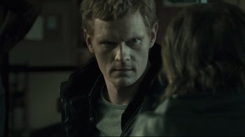 Movie still from “Submarino” (2010), directed by Thomas Vinterberg – A person wearing a black jacket; Close Up shot, Over the shoulder angle