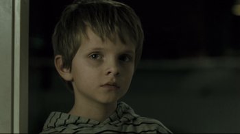 Movie still from “Submarino” (2010), directed by Thomas Vinterberg – A young boy is looking into the distance; Close Up shot, Low angle