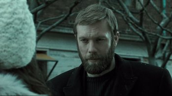 Movie still from “Submarino” (2010), directed by Thomas Vinterberg – A man with a goatee and a beard; Close Up shot, Over the shoulder angle