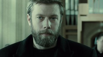 Movie still from “Submarino” (2010), directed by Thomas Vinterberg – A person with a beard; Close Up shot, Over the shoulder angle