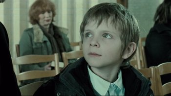 Movie still from “Submarino” (2010), directed by Thomas Vinterberg – A young boy sitting next to an older woman; Close Up shot, Over the shoulder angle