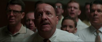 Movie still from “Suburbicon” (2017), directed by George Clooney – A group of people in a room looking up at the ceiling; Close Up shot, Low angle