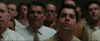 Movie still from “Suburbicon” (2017), directed by George Clooney – A group of men standing next to each other in a room; Close Up shot, Low angle
