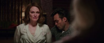 Movie still from “Suburbicon” (2017), directed by George Clooney – A man and a woman sitting next to each other; Medium shot, Over the shoulder angle