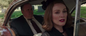 Movie still from “Suburbicon” (2017), directed by George Clooney – A man and a woman sitting in the back of a car; Close Up shot, Over the shoulder angle