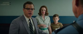 Movie still from “Suburbicon” (2017), directed by George Clooney – A man , woman , and boy are standing in a room together; Medium shot, Over the shoulder angle