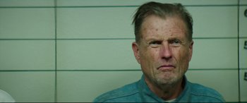 Movie still from “Suburbicon” (2017), directed by George Clooney – A person wearing a blue shirt; Close Up shot, Low angle