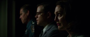 Movie still from “Suburbicon” (2017), directed by George Clooney – A man and a woman sitting next to each other in a dark room; Close Up shot, Over the shoulder angle