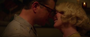 Movie still from “Suburbicon” (2017), directed by George Clooney – A man and a woman smiling at each other; Close Up shot, Low angle