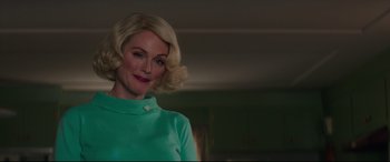 Movie still from “Suburbicon” (2017), directed by George Clooney – A woman with blonde hair wearing a green shirt; Medium shot, Low angle
