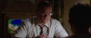Movie still from “Suburbicon” (2017), directed by George Clooney – A man in a white shirt and a tie; Close Up shot, Low angle