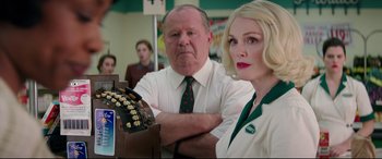 Movie still from “Suburbicon” (2017), directed by George Clooney – A man and a woman standing next to each other in a room; Medium shot, Over the shoulder angle