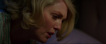 Movie still from “Suburbicon” (2017), directed by George Clooney – A woman's face with blonde hair; Close Up shot, Over the shoulder angle