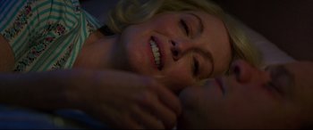 Movie still from “Suburbicon” (2017), directed by George Clooney – A woman laying on the ground with her eyes closed; Close Up shot, Overhead angle