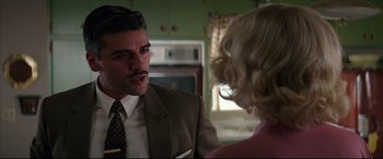 Movie still from “Suburbicon” (2017), directed by George Clooney – A man and a woman are talking in a kitchen; Close Up shot, Over the shoulder angle