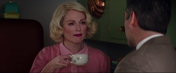 Movie still from “Suburbicon” (2017), directed by George Clooney – A woman holding a coffee cup in a kitchen; Close Up shot, Over the shoulder angle