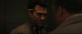 Movie still from “Suburbicon” (2017), directed by George Clooney – A person wearing a headset; Close Up shot, Over the shoulder angle