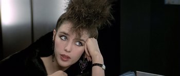 A person with a hair piece on