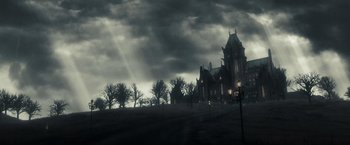 Movie still from “Sucker Punch” (2011), directed by Zack Snyder – A dark picture of an old house in the middle of the night; Extreme Wide shot, Low angle