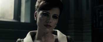 Movie still from “Sucker Punch” (2011), directed by Zack Snyder – A person wearing a dress; Close Up shot, Low angle